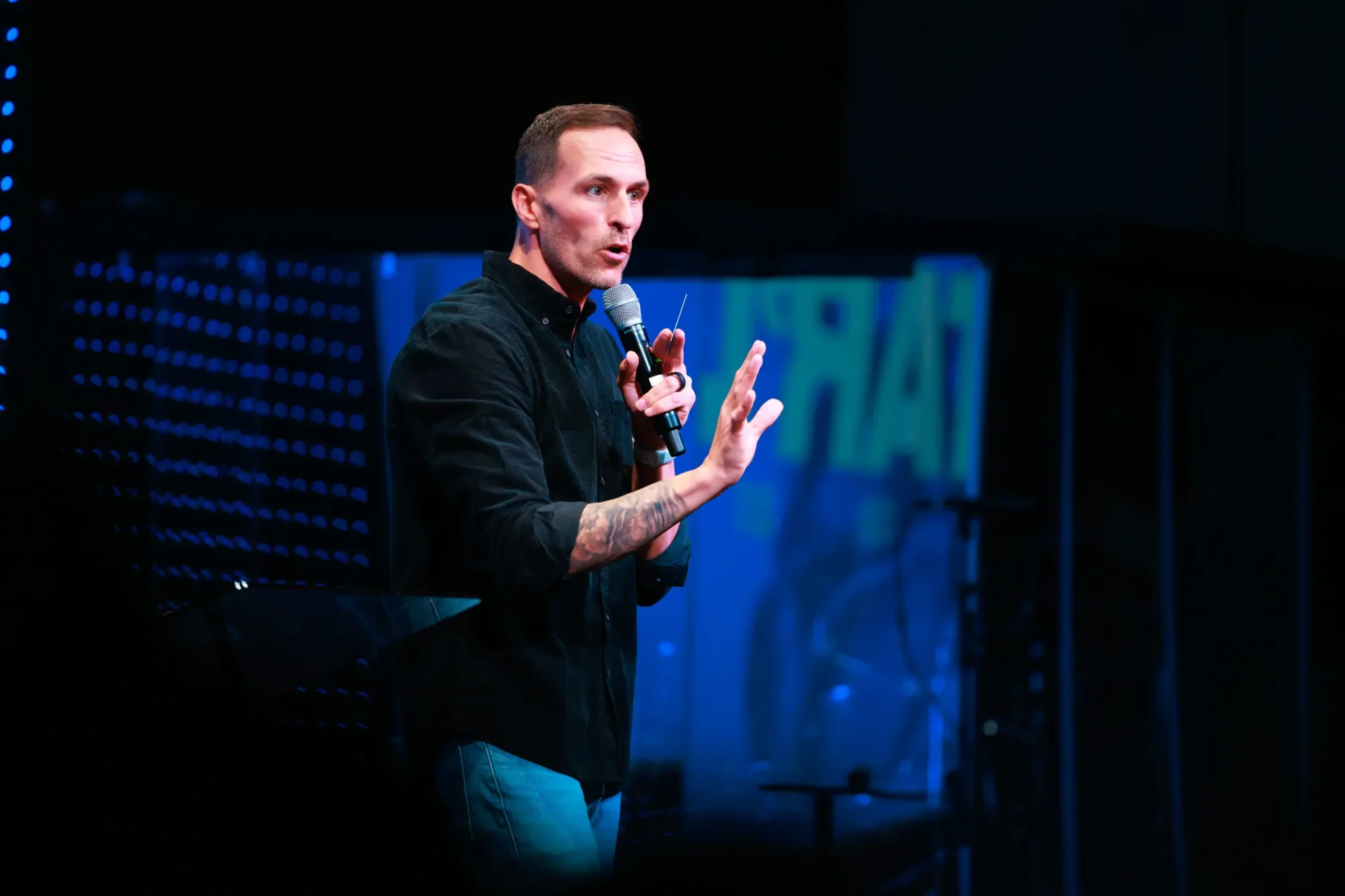 Pastor Jared Fabac speaking into a microphone